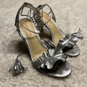 Women’s Marc Fisher
Metallic Silver Sz 7.5 Ankle Wrap Tassel Stiletto Heels
